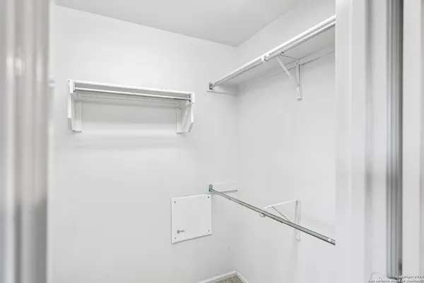 a view of an empty walk in closet