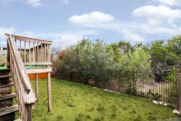a balcony with trees in front of it
