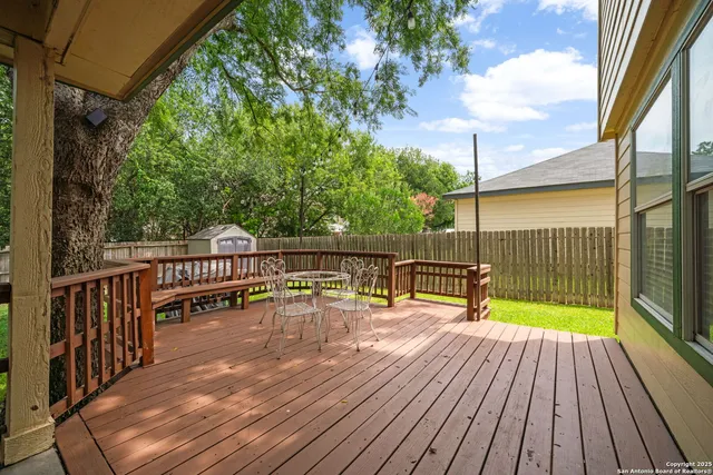 a view of balcony with deck and wooden floor
