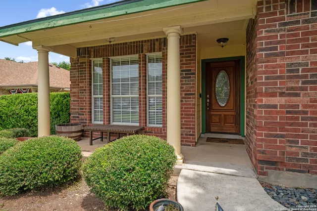 a front view of a house with a outdoor seating