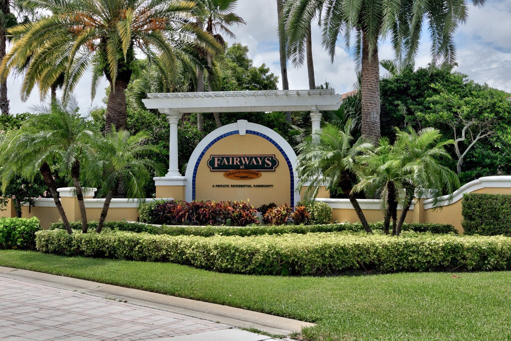 5095 Fairways Circle, Unit I201 Vero Beach, FL 32967 - Photo 36 of 36 a front view of a house with a garden
