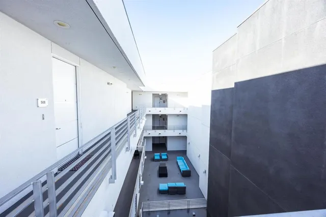 a view of balcony with wooden floor