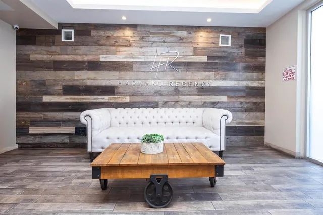 a bed sitting in a room next to a window