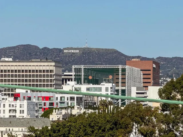 a view of house with outdoor space and blue swimming pool