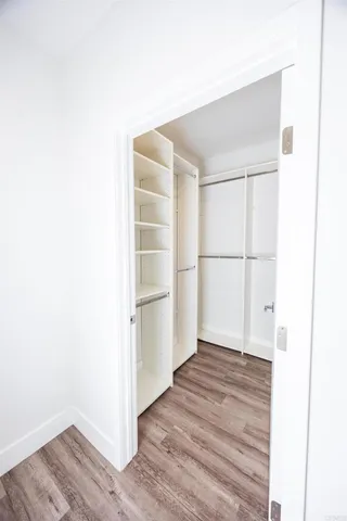 a view of wooden floor in an empty room