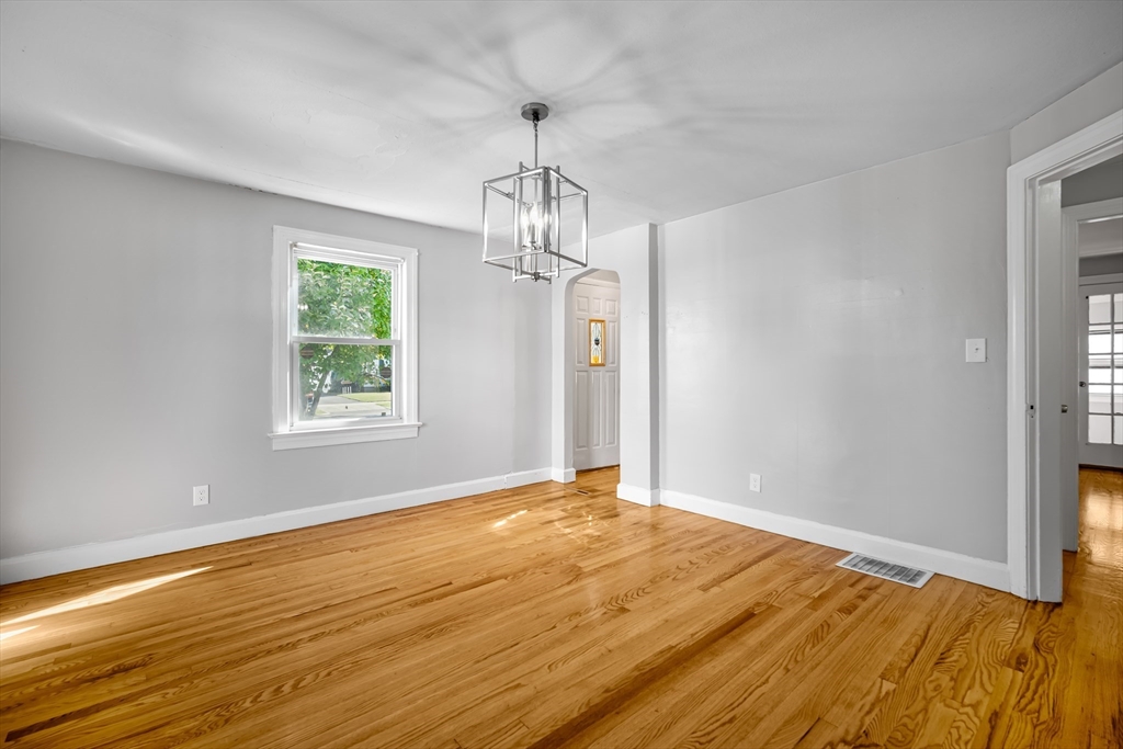 216 Windemere Street Springfield, MA 01104 - Photo 11 of 35 a view of empty room with wooden floor and fan