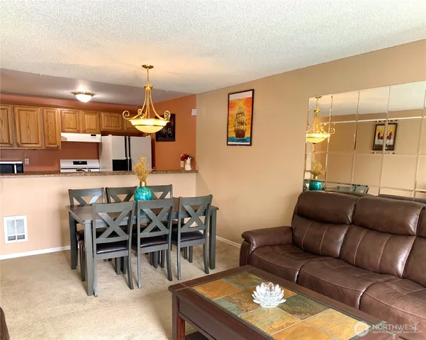 a view of a dining room with furniture
