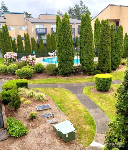 a view of a swimming pool with a patio