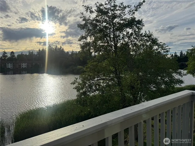 a view of a lake from a balcony