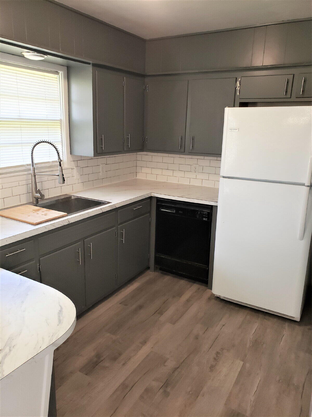 4906 6th Street Lubbock, TX 79416 - Photo 19 of 24 a kitchen with sink and white stainless steel appliances