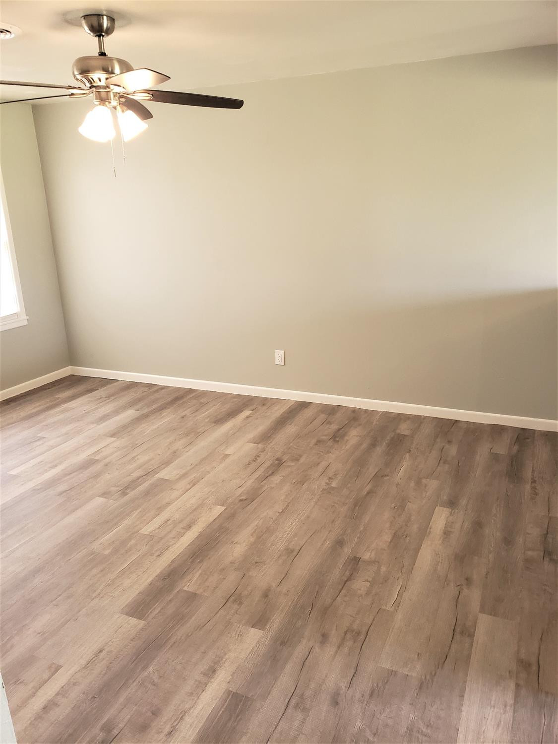 4906 6th Street Lubbock, TX 79416 - Photo 2 of 24 wooden floor in a empty room