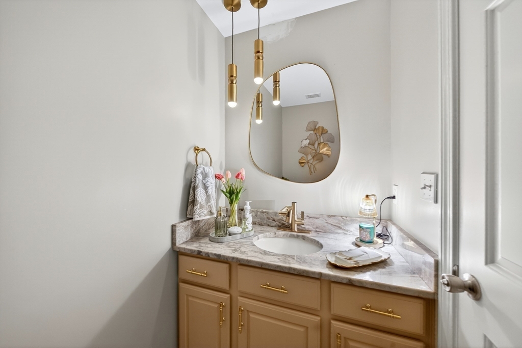 2 Hitching Post Lane Methuen, MA 01844 - Photo 16 of 40 a bathroom with a sink and a mirror