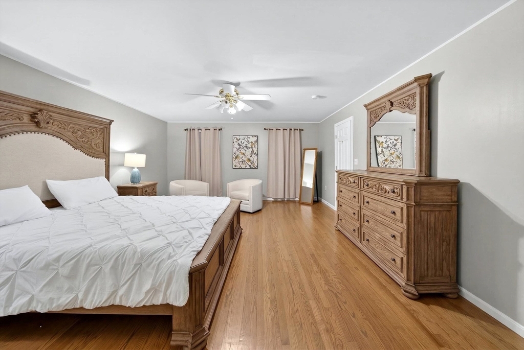 2 Hitching Post Lane Methuen, MA 01844 - Photo 19 of 40 a spacious bedroom with a bed and wooden floor
