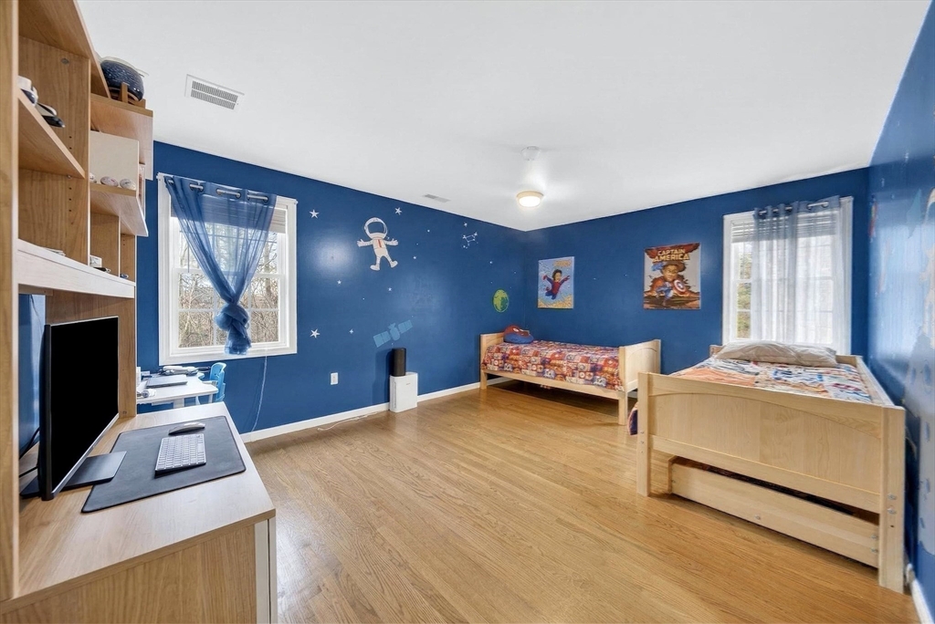 2 Hitching Post Lane Methuen, MA 01844 - Photo 26 of 40 a bedroom with a bed and a fireplace