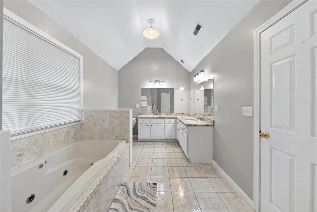 2 Hitching Post Lane Methuen, MA 01844 - Photo 29 of 40 a bathroom with a tub a sink and a shower