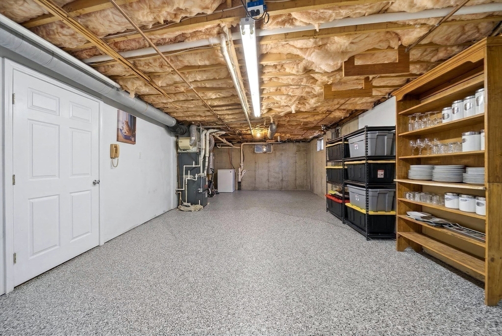 2 Hitching Post Lane Methuen, MA 01844 - Photo 39 of 40 a view of an empty room with a stairs