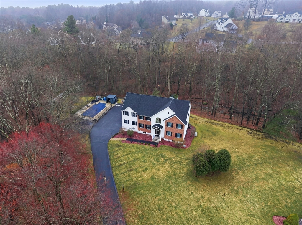 2 Hitching Post Lane Methuen, MA 01844 - Photo 4 of 40 a view of a chairs in a backyard