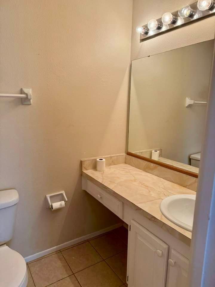 Undisclosed Address Port St. Lucie, FL 34952 - Photo 11 of 34 a bathroom with a sink and a toilet