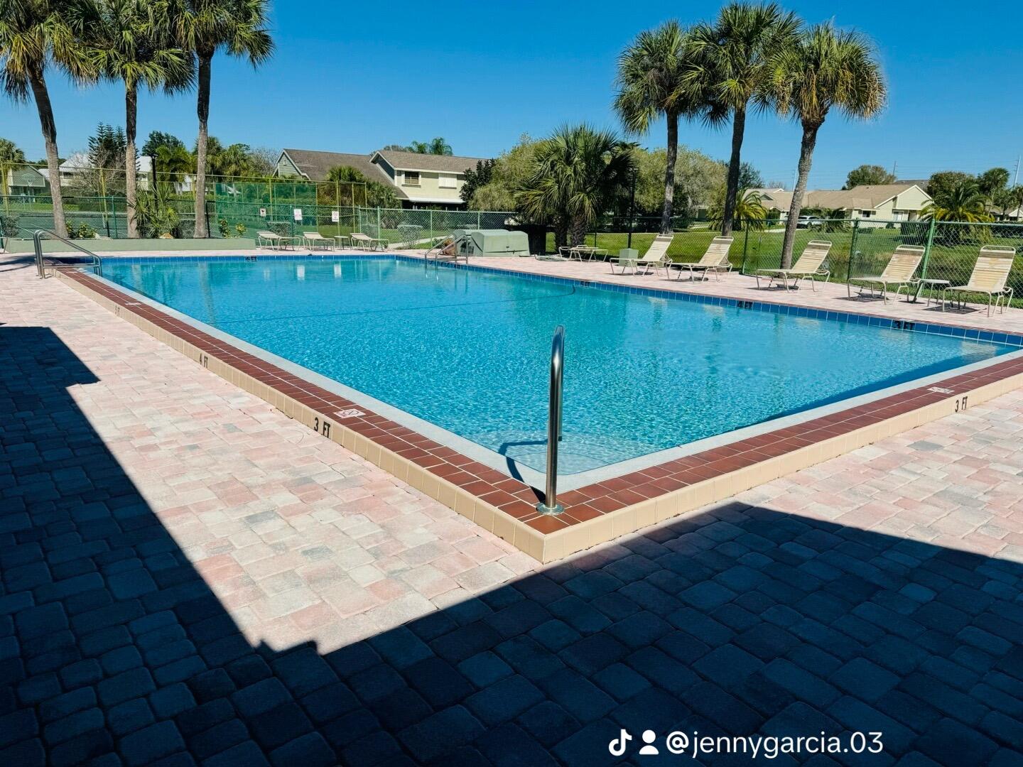 Undisclosed Address Port St. Lucie, FL 34952 - Photo 30 of 34 a view of swimming pool with a table and chairs