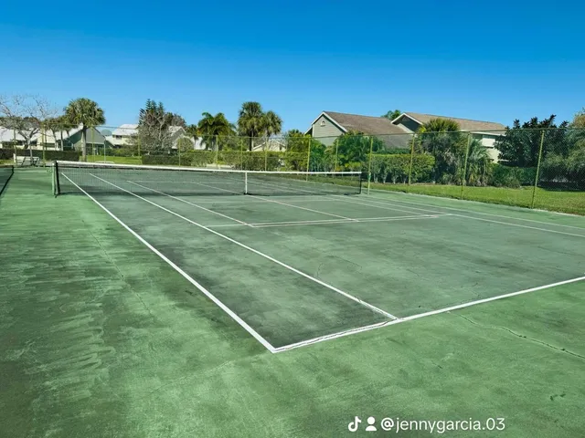 a view of a dining room with furniture wooden floor and a flat screen tv