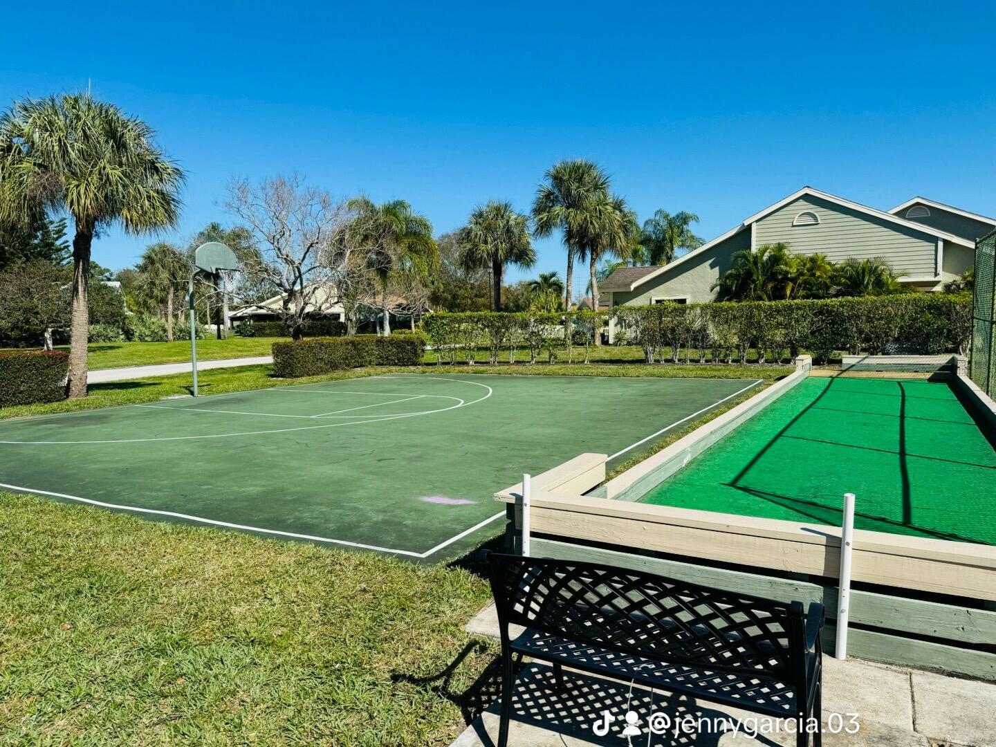 Undisclosed Address Port St. Lucie, FL 34952 - Photo 33 of 34 a view of a backyard with table and chairs under an umbrella