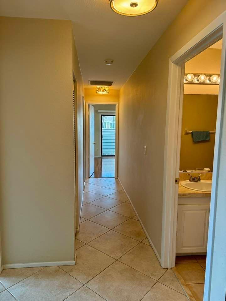 Undisclosed Address Port St. Lucie, FL 34952 - Photo 7 of 34 a view of a hallway to a room with a bathroom