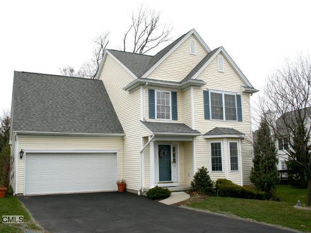 115 Logging Trail Road Danbury, CT 06811 - Photo 1 of 1 a view of a white house with large windows