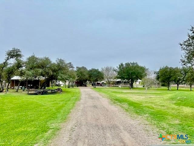 103 Forest View Drive Victoria, TX 77905 - Photo 4 of 20 a view of a park with large trees and plants