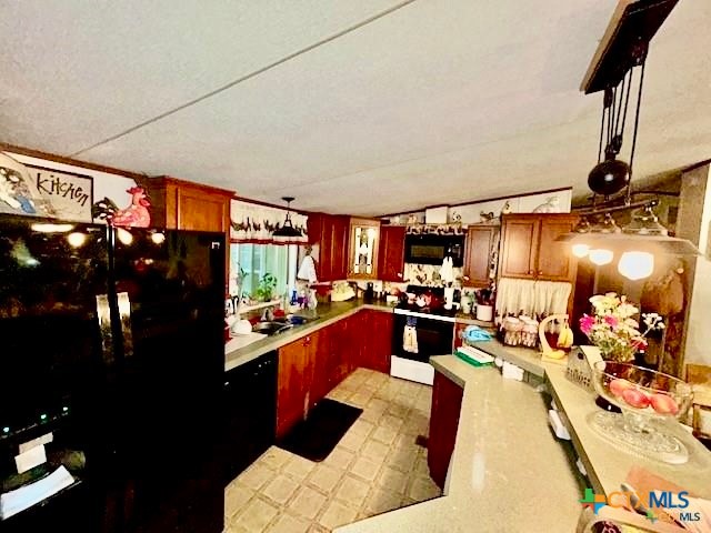 103 Forest View Drive Victoria, TX 77905 - Photo 9 of 20 a kitchen with stainless steel appliances kitchen island granite countertop a refrigerator and a stove