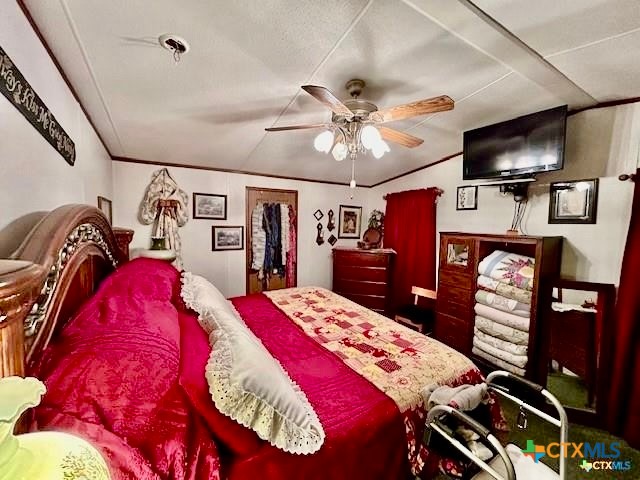 103 Forest View Drive Victoria, TX 77905 - Photo 10 of 20 a bed room with a bed a television and dresser