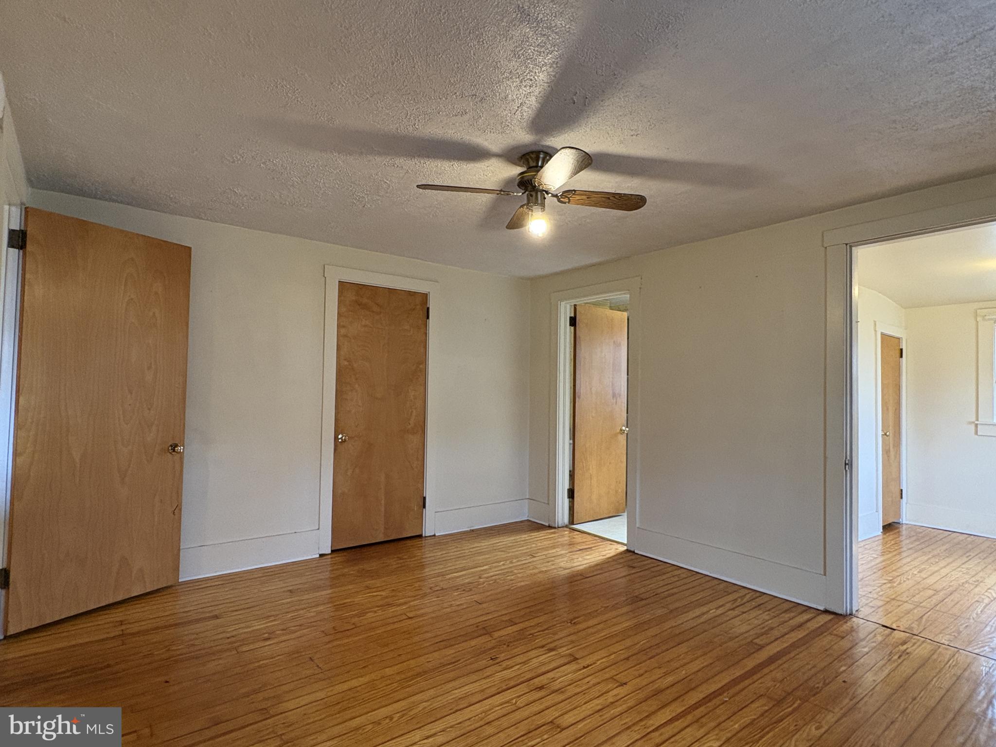 119 Maffitt Street, Unit 4 Elkton, MD 21921 - Photo 12 of 17 a view of a livingroom with a ceiling fan window and wooden floor
