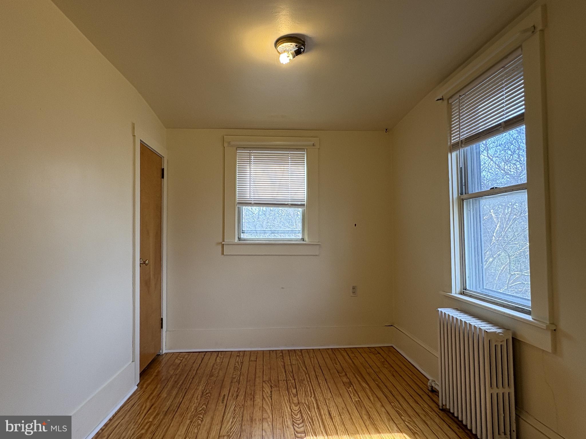 119 Maffitt Street, Unit 4 Elkton, MD 21921 - Photo 13 of 17 wooden floor in an empty room with a window