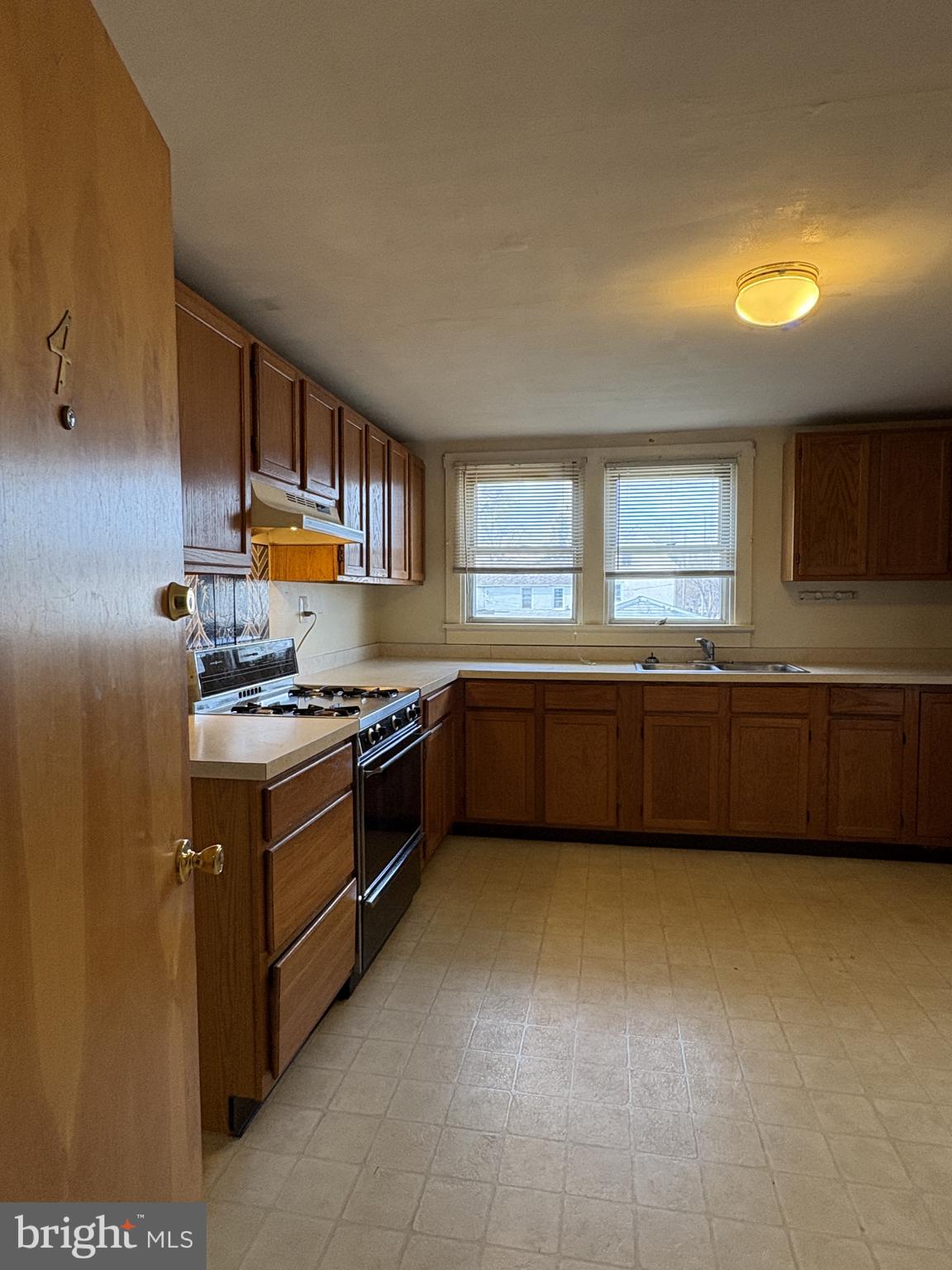 119 Maffitt Street, Unit 4 Elkton, MD 21921 - Photo 3 of 17 a kitchen with stainless steel appliances a sink and cabinets