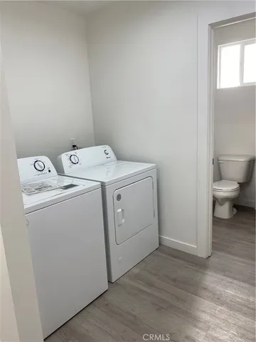 a view of storage and utility room with washer and dryer