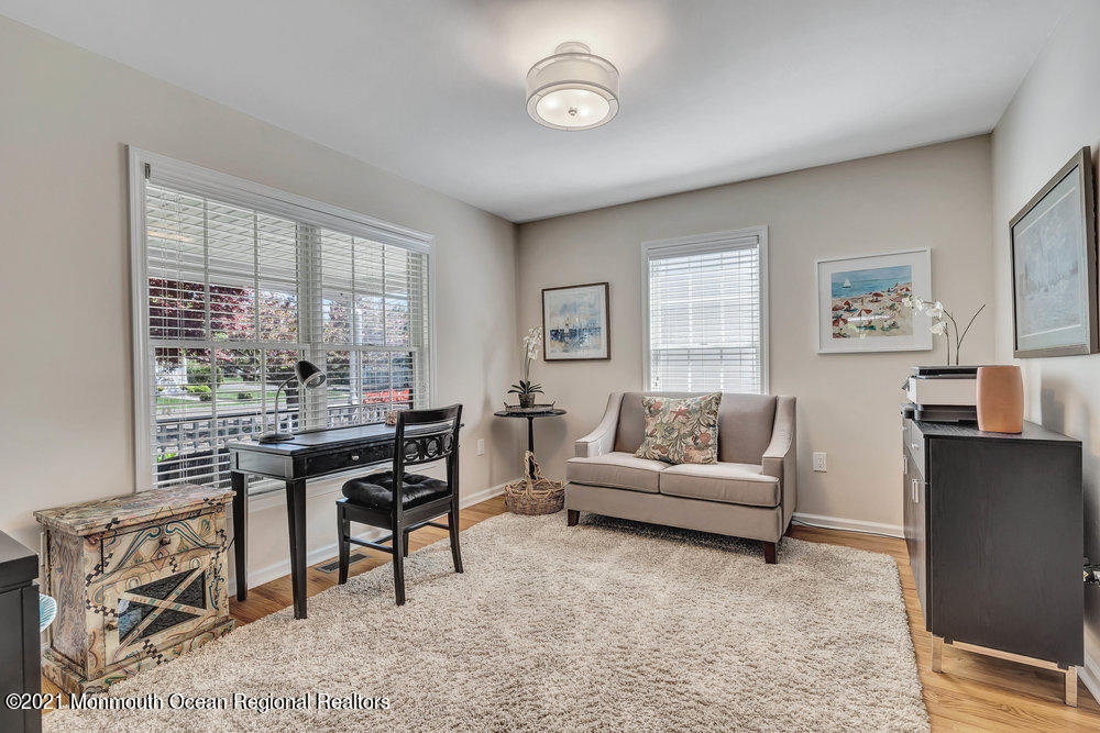 303 Salem Avenue Spring Lake, NJ 07762 - Photo 12 of 38 a living room with furniture and a large window