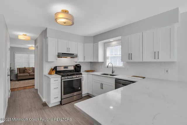 a kitchen with a stove and a sink