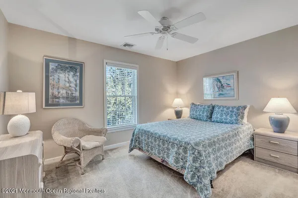 a bedroom with a bed and chair
