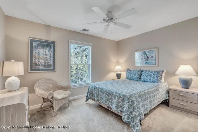 a bedroom with a bed and chair