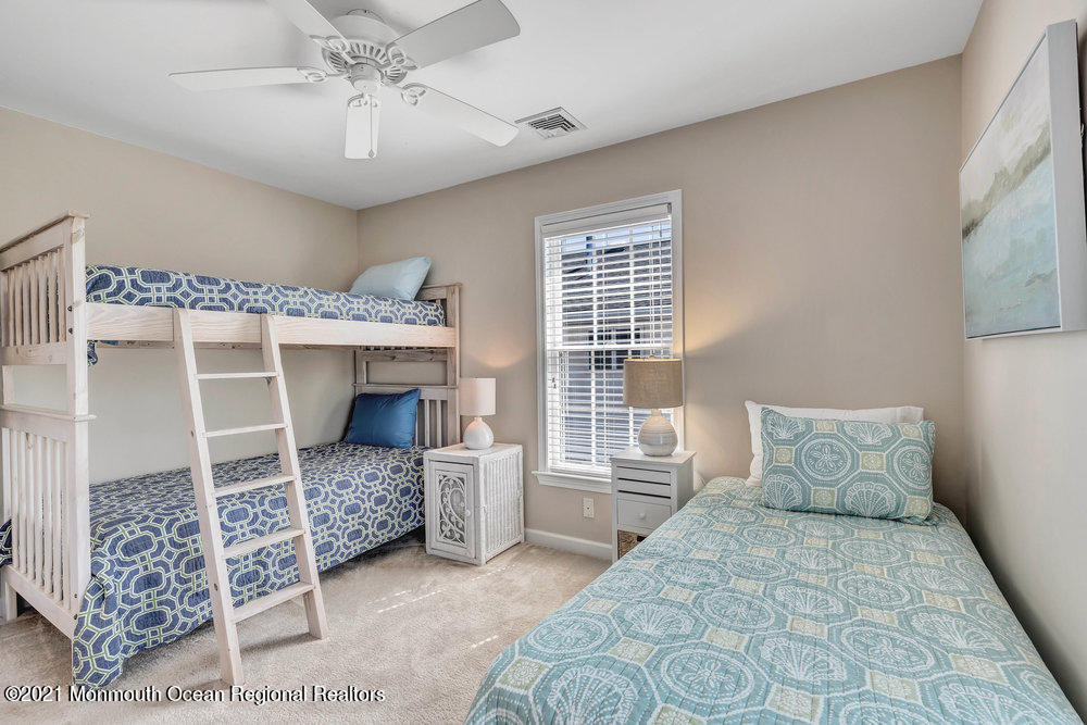 303 Salem Avenue Spring Lake, NJ 07762 - Photo 25 of 38 a bedroom with a bed and a window