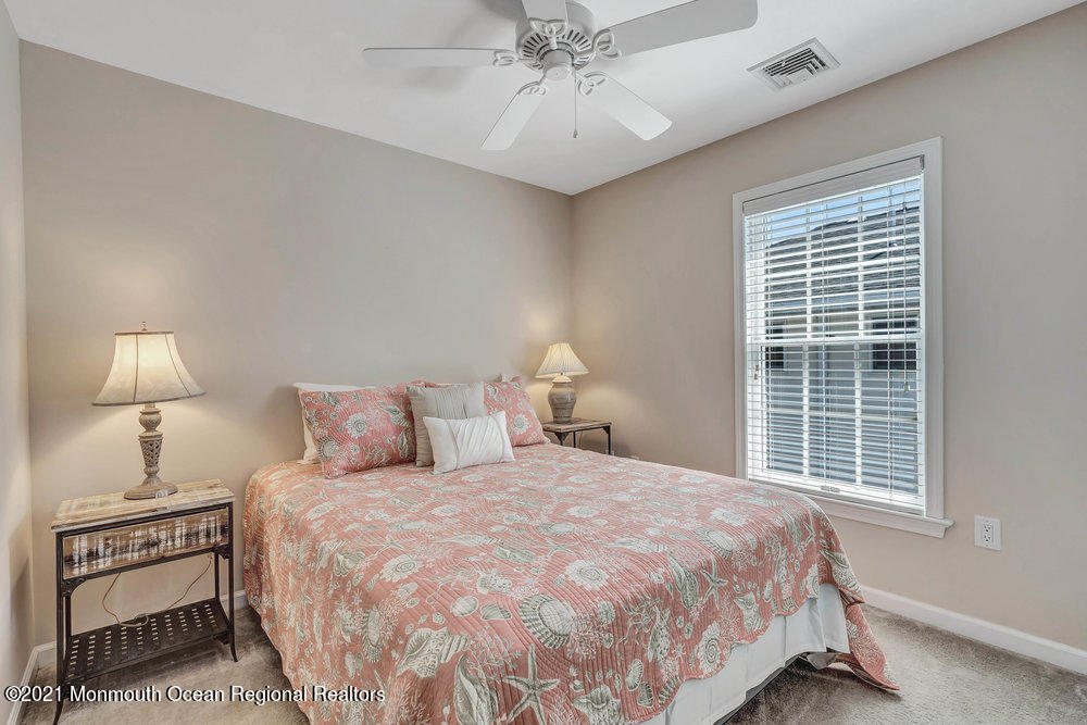 303 Salem Avenue Spring Lake, NJ 07762 - Photo 26 of 38 a bedroom with a bed and a night stand