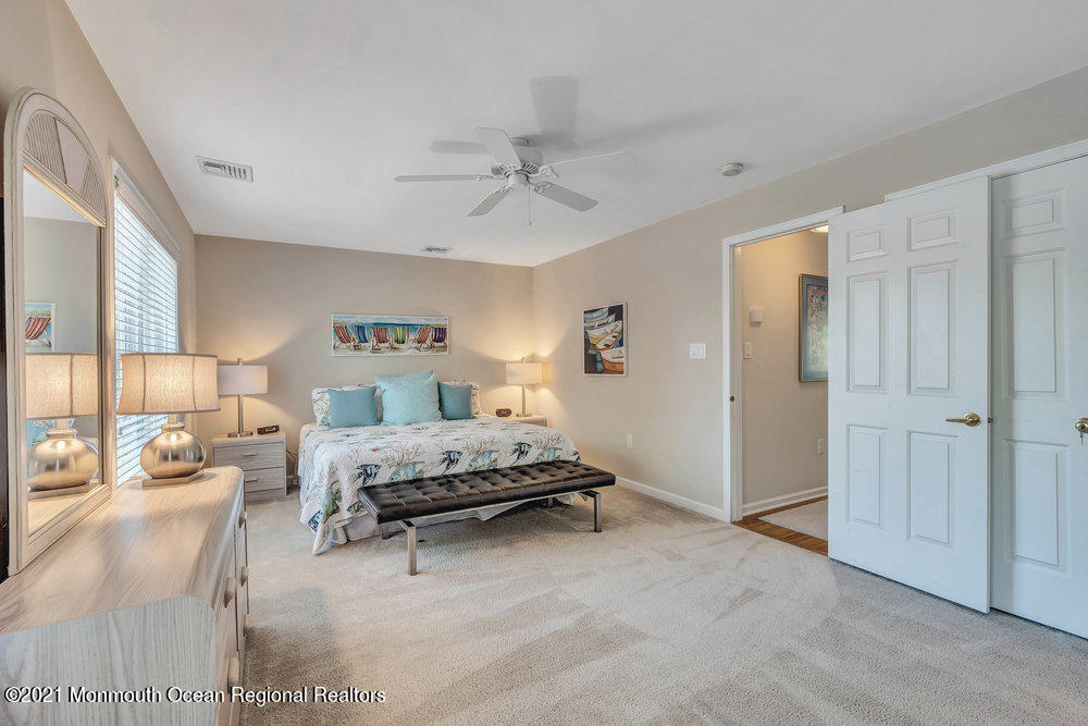 303 Salem Avenue Spring Lake, NJ 07762 - Photo 29 of 38 a living room with furniture and a chandelier