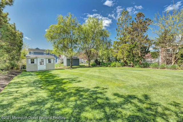 a view of a house with a big yard