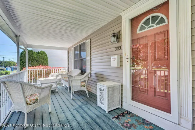 a view of a balcony with furniture
