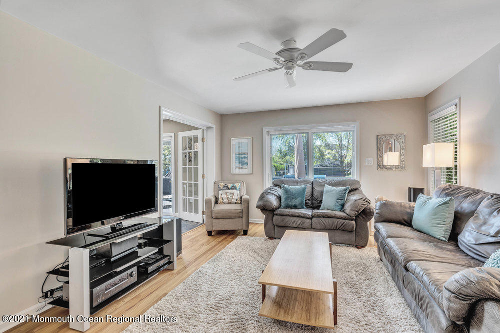 303 Salem Avenue Spring Lake, NJ 07762 - Photo 10 of 38 a living room with furniture and a flat screen tv