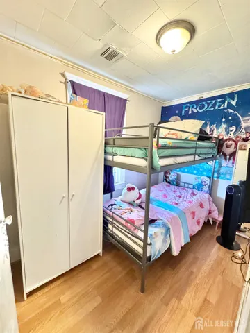 a bedroom with a bed and a closet