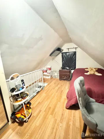 a bed room with furniture and air hockey table