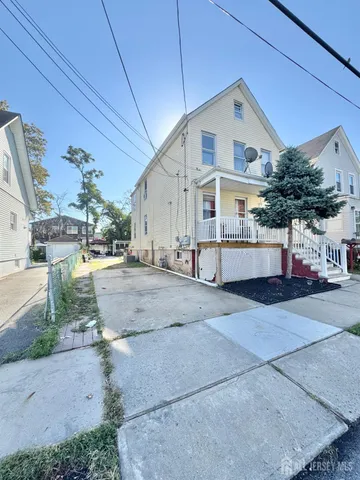 a view of a house with a street