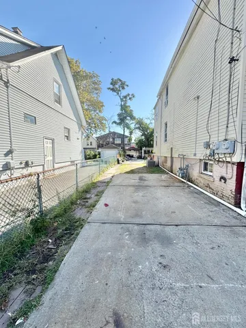 a view of a patio with table and chairs a barbeque and potted plants