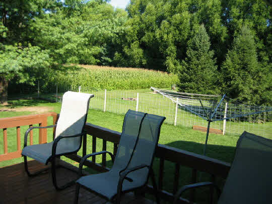 13795 Cook Road Pecatonica, IL 61063 - Photo 9 of 11 a view of a chairs and table in patio and a yard