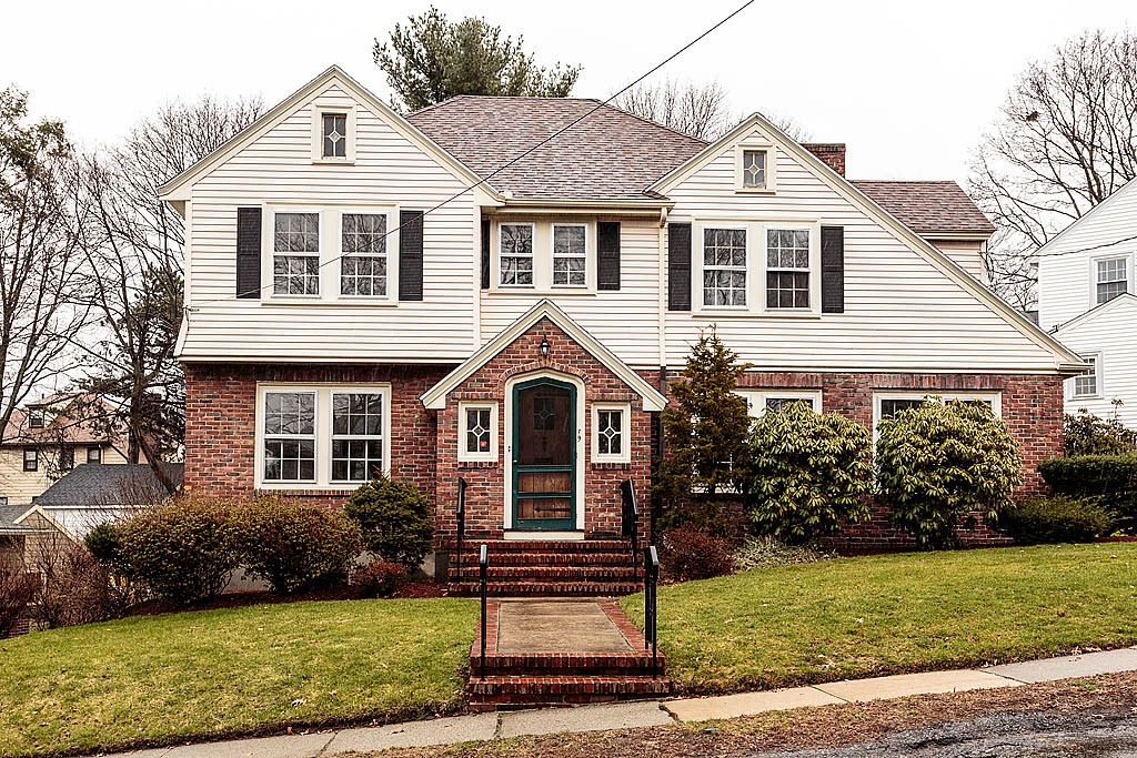 79 Douglas Road Belmont, MA 02478 - Photo 1 of 17 a front view of a house with a garden